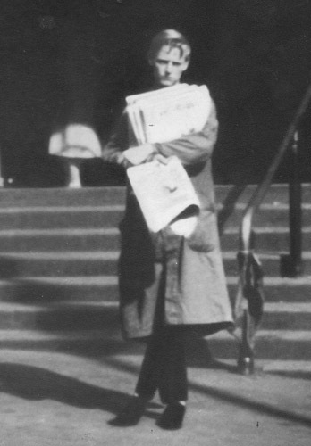 Michael Binney at age 17 selling papers on the steps of the station
